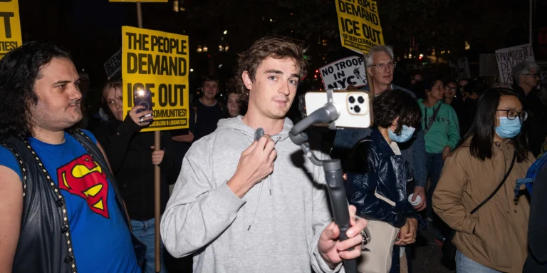 Nick Shirley filming an investigative YouTube journalism report that sparked debate over mainstream media in 2026